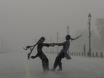Gram it: Heavy monsoon showers kept Delhi on Red alert and the commuters battled traffic snarls for hours, on Monday. At Kartavya Path, however, some youngsters indulged in joie de vivre as they soaked up every moment of the downpour. Meanwhile, the India Meteorological Department (IMD) has issued a forecast of moderate rain and cloudy skies for today.(Photo: Arun Sharma/PTI)