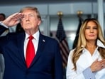 President Donald Trump with first lady Melania Trump during the National Anthem at the start of the Freedom 250 Grand Prix race. Doug Mills/Pool via REUTERS