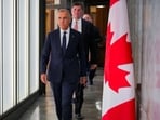 Canada’s Prime Minister Mark Carney walks to speak with the news media after he suspended trade negotiations with the United States, in Ottawa, Ontario, Canada August 22, 2026.  REUTERS/Chris Tanouye