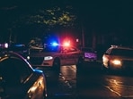 CCTV footage secured by CBS News depicted two individuals involved in a physical scuffle along the road, immediately followed by a sudden flash indicating a gun discharge.