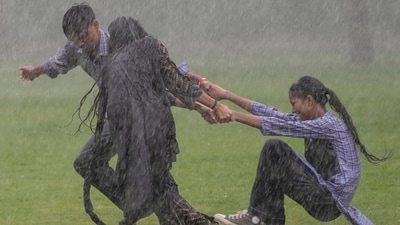 Students play near Kartavya Path amid monsoon showers, in New Delhi, Monday, Aug. 24, 2026. The weather office issued a red alert for heavy rain and a yellow alert for moderate rain across several districts, with thunderstorms, lightning and winds of 30-40 kmph also expected in parts of the city. (PTI)