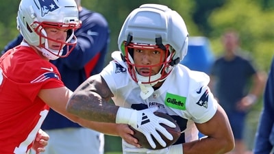 TreVeyon Henderson left Monday’s practice early after slipping during a cut. (AP Photo) TreVeyon Henderson left Monday’s practice early after slipping during a cut. (AP Photo)