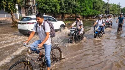 Waterlogging was also reported around Sector 29, Club Palms and the main road near DLF Super Mart. (PTI) Waterlogging was also reported around Sector 29, Club Palms and the main road near DLF Super Mart. (PTI)