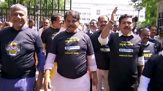 BJP leaders hold a protest march from the Valmiki statue to Vidhana Soudha demanding the resignation of Karnataka Minister B Nagendra over his alleged involvement in the Maharshi Valmiki Scheduled Tribes Development Corporation funds embezzlement scam, in Bengaluru. (ANI Video Grab)