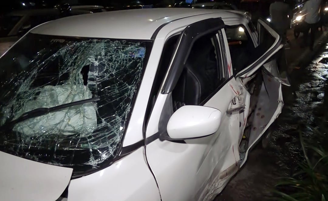 A view of the damaged out-of-control car after it crashed through the divider, in front of the old Police Headquarters, at the ITO traffic signal, in New Delhi on Sunday. (ANI Video Grab) A view of the damaged out-of-control car after it crashed through the divider, in front of the old Police Headquarters, at the ITO traffic signal, in New Delhi on Sunday. (ANI Video Grab)