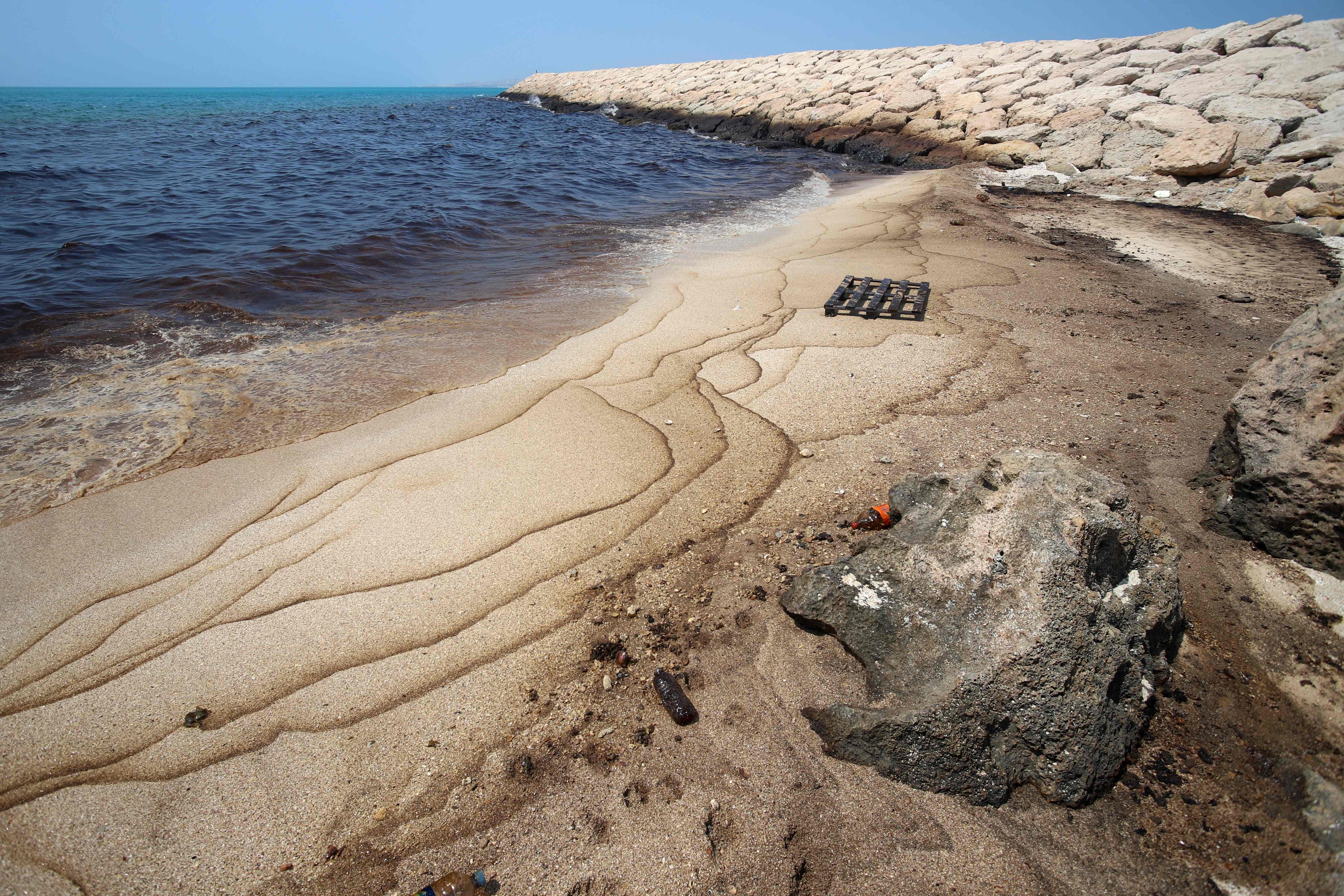 This photograph from Iran's ISNA news agency on August 13, 2026 shows an oil slick along the southern coast of Qeshm Island. Tankers have been frequently targeted in the Gulf in recent months. (AFP)