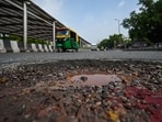 Traffic passes along a pothole-ridden Mathura road at Ashram Chowk during the monsoon in New Delhi, August 12, 2026. 