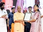 CM Yogi Adityanath handed over appointment letters to 3,446 technical assistants, 126 mandi secretaries on Tuesday. (HT)