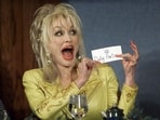 Country Music star Dolly Parton jokes with members of the National Press Club prior to her remarks March 23.(REUTERS)