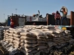FILE PHOTO: Workers unload sacks of sugar from trucks and place them in a net to be loaded onto a cargo ship at the Deendayal Port in Kandla, in the western state of Gujarat, India, April 5, 2025 (REUTERS)