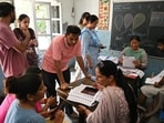 BLOs verify voter details during the SIR of electoral rolls (Photo by Narinder NANU / AFP)