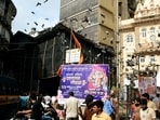 People gather at the site after a Ganesh idol of 'Bhuleshwaracha Raja' fell during its arrival ceremony on Saturday, in Bhuleshwar, Mumbai, Maharashtra, Sunday, Aug. 23, 2026.(PTI)