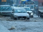 Commuters faced major difficulties as vehicles moved at a crawl through waterlogged stretches.