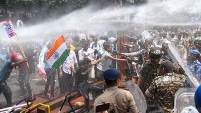 Police personnel use water cannons to disperse students protesting against alleged irregularities in recruitment examinations, near Dak Bungalow crossing, in Patna, Bihar. (PTI) Police personnel use water cannons to disperse students protesting against alleged irregularities in recruitment examinations, near Dak Bungalow crossing, in Patna, Bihar. (PTI)