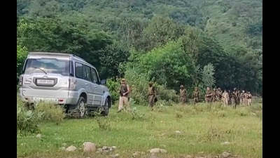Security personnel keep vigil during a joint search-and-combing operation after an active wireless signal was detected, in Samba, Jammu and Kashmir, on Tuesday. (PTI)