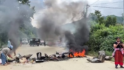 A vehicle set on fire on a road in Taphou area amid reports of violence, in Senapati on Monday. (ANI Video Grab) A vehicle set on fire on a road in Taphou area amid reports of violence, in Senapati on Monday. (ANI Video Grab)