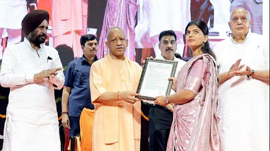 CM Yogi Adityanath handed over appointment letters to 3,446 technical assistants, 126 mandi secretaries on Tuesday. (HT)