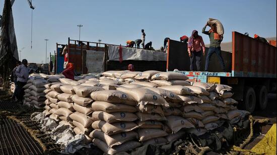 FILE PHOTO: Workers unload sacks of sugar from trucks and place them in a net to be loaded onto a cargo ship at the Deendayal Port in Kandla, in the western state of Gujarat, India, April 5, 2025 (REUTERS)