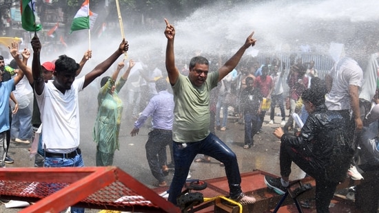 Patna Student Protest Live: People shout slogans as police use water cannons to disperse them during a protest demanding cancellation of a civil services recruitment examination over allegations of question paper leaks and other irregularities, in Patna, India, August 25, 2026. (REUTERS)