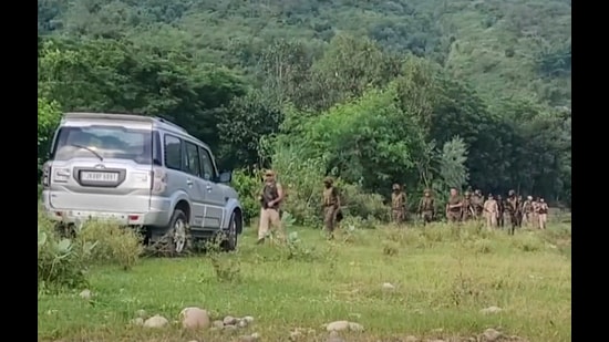 Security personnel keep vigil during a joint search-and-combing operation after an active wireless signal was detected, in Samba, Jammu and Kashmir, on Tuesday. (PTI)