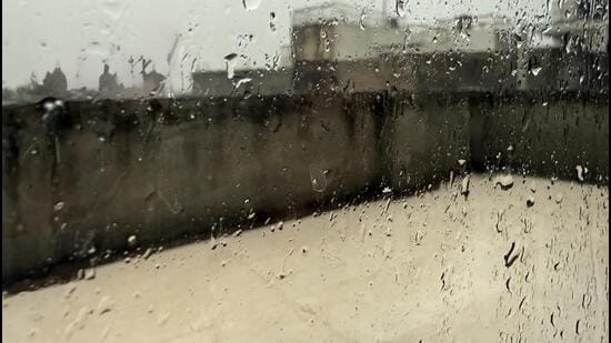 This Tuesday morning, rain is lashing a Delhi terrace. Seen through a room’s raindrop-covered window, the terrace is drenched and deserted, see photo. This was what the room was meant for: a place to run to when the barsat arrived. A barsati. (HT Photo)
