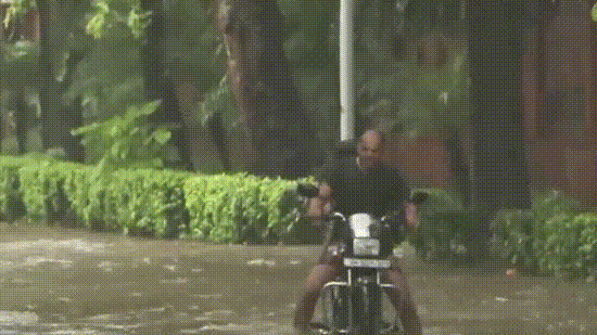 Delhi NCR weather LIVE: Commuters wade through knee-deep water in Delhi. Delhi NCR weather LIVE: Commuters wade through knee-deep water in Delhi.
