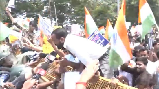 The protesters tried to enter the restricted area after police blocked their route with barricades.