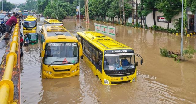 School buses remain stuck at Subhash Chowk on . (HT) School buses remain stuck at Subhash Chowk on . (HT)