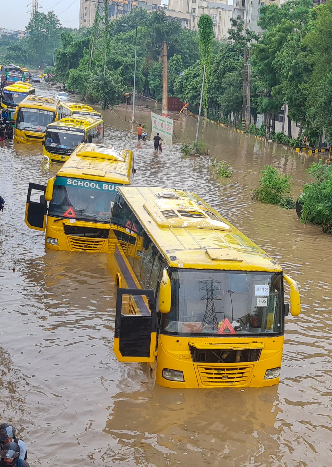 School buses remain stuck on a waterlogged road following heavy monsoon rain at Subhash Chowk near Sector 47 in Gurugram, Monday, 24 August 2026. (Hindustan Times) School buses remain stuck on a waterlogged road following heavy monsoon rain at Subhash Chowk near Sector 47 in Gurugram, Monday, 24 August 2026. (Hindustan Times)