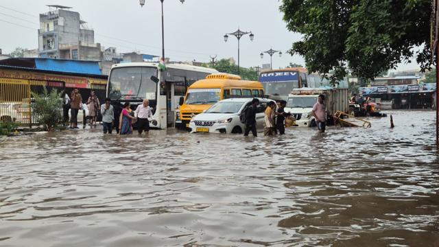 (Video grab) Commuters wade through a flooded stretch of Sheetla Mata Road on Monday. (ANI ) (Video grab) Commuters wade through a flooded stretch of Sheetla Mata Road on Monday. (ANI )