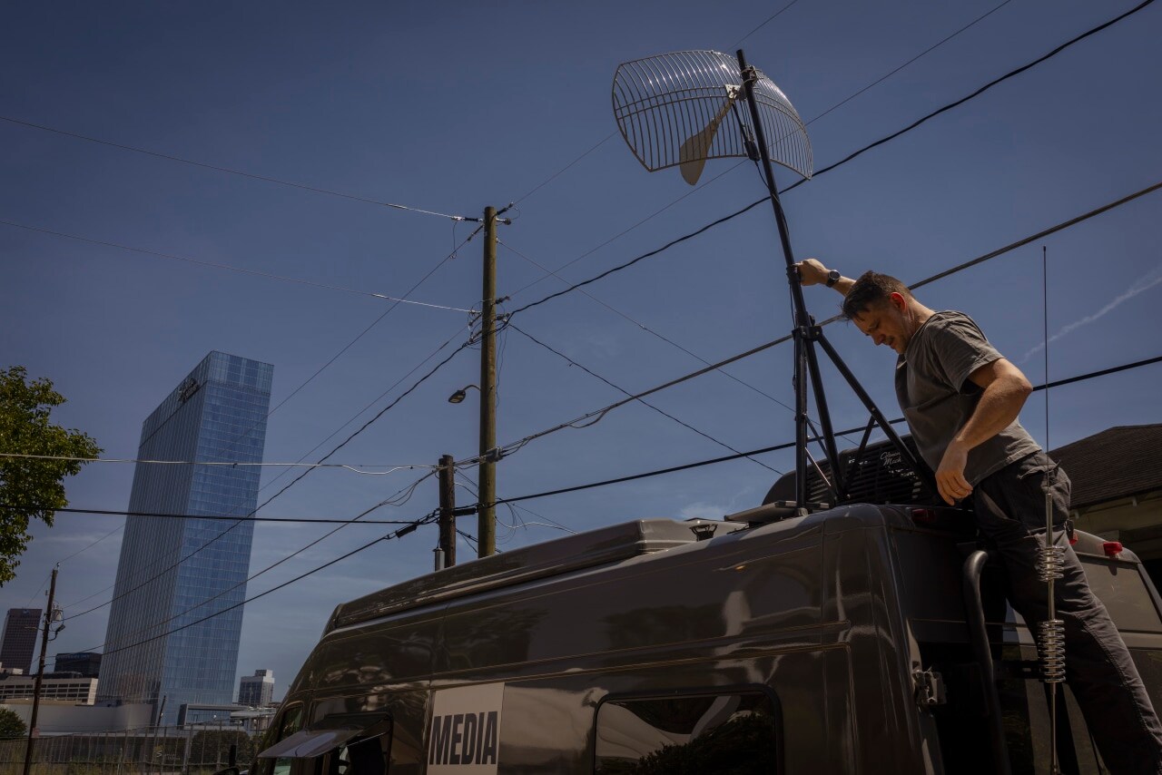 Benn Jordan and a van, loaded with electronics, outside the Flock Forward 2026 conference.