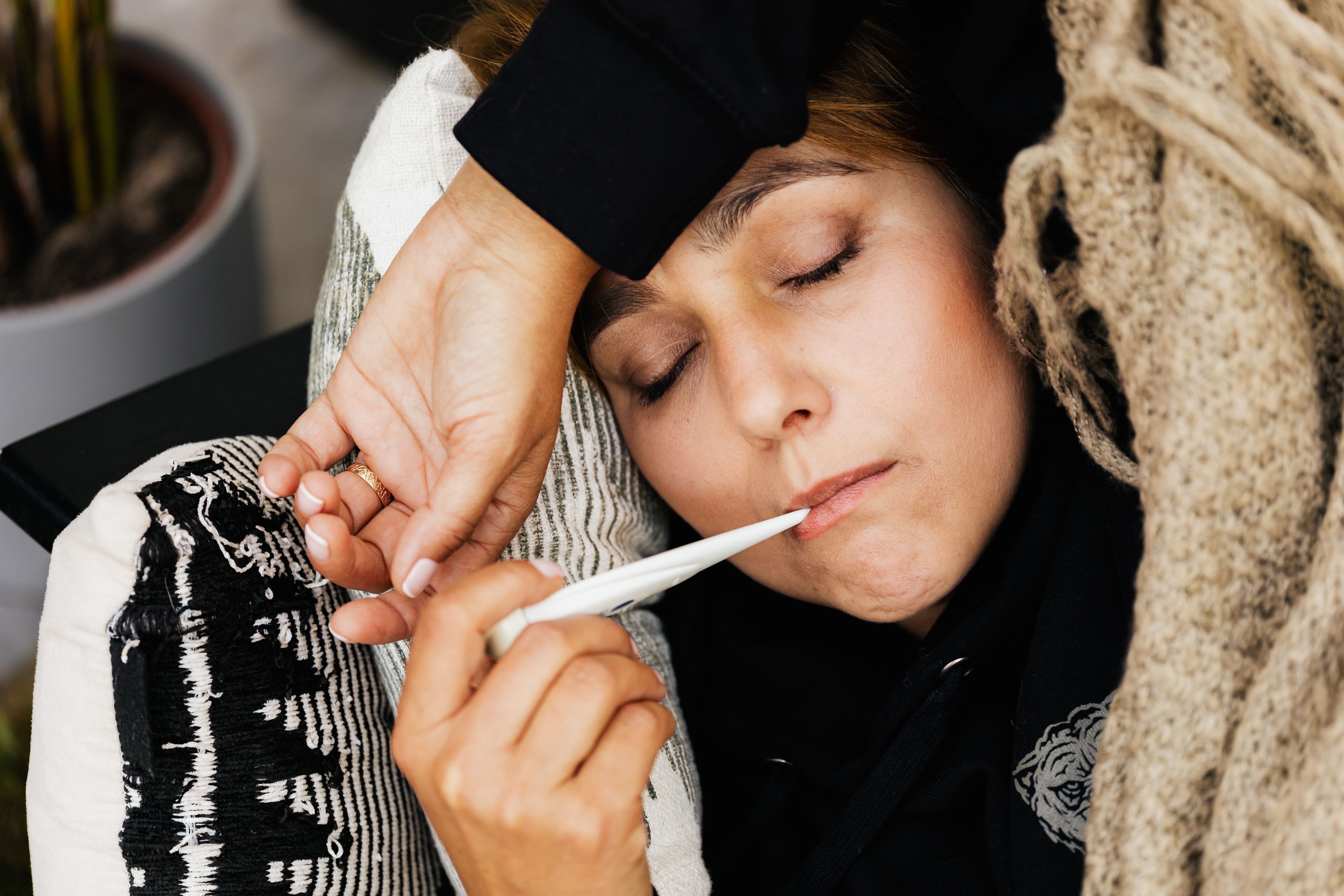 A persistently high fever after vaccination needs medical evaluation. (Pexel)
