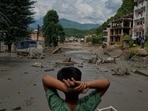 A boy looks at the devastation caused by flash flooding along the Trishuli River in Nepal's Nuwakot district, Wednesday, Aug. 26, 2026. (AP Photo/Niranjan Shrestha)