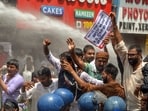 Police personnel use a water cannon on protestors as they raise slogans during a Mukhyamantri Gherao march over education and employment issues, organised by the Chhatra Yuva Sangharsh Morcha, in Patna, Bihar on Tuesday.