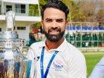 Left-arm spinner Abid Mushtaq posing with the cup after Jammu & Kashmir’s Ranji Trophy victory in February, 2026. (Source pic) Left-arm spinner Abid Mushtaq posing with the cup after Jammu & Kashmir’s Ranji Trophy victory in February, 2026. (Source pic)