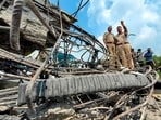 Security officials at the site after a concrete bridge pier collapsed during construction work, in Samba district of Jammu and Kashmir, on Tuesday. (PTI)