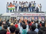 Student leader Devendra Nath Mahto, along with other members, stands on a bus during Recruitment Reform Yatra, alleging irregularities and a lack of transparency in the recruitment process in the JPSC-JSSC recruitment, in Hazaribagh on Wednesday. (ANI PHOTO)