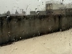 This Tuesday morning, rain is lashing a Delhi terrace. Seen through a room’s raindrop-covered window, the terrace is drenched and deserted, see photo. This was what the room was meant for: a place to run to when the barsat arrived. A barsati. (HT Photo)