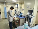 A doctor checks medical equipment in a dedicated isolation ward set up at Lok Nayak Jai Prakash (LNJP) Hospital for the treatment and management of H1N1 (swine flu) patients, in New Delhi on Tuesday. (ANI)