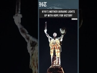 Kyiv Monument Lights Up With Ukrainian Symbols as Nation Hopes for Victory