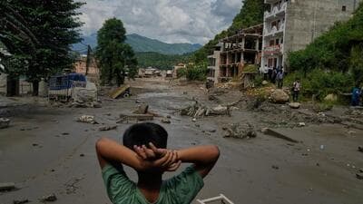 A boy looks at the devastation caused by flash flooding along the Trishuli River in Nepal's Nuwakot district, Wednesday, Aug. 26, 2026. (AP Photo/Niranjan Shrestha) A boy looks at the devastation caused by flash flooding along the Trishuli River in Nepal's Nuwakot district, Wednesday, Aug. 26, 2026. (AP Photo/Niranjan Shrestha)