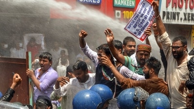 Police personnel use a water cannon on protestors as they raise slogans during a Mukhyamantri Gherao march over education and employment issues, organised by the Chhatra Yuva Sangharsh Morcha, in Patna, Bihar on Tuesday. (Pappi Sharma/ANI) Police personnel use a water cannon on protestors as they raise slogans during a Mukhyamantri Gherao march over education and employment issues, organised by the Chhatra Yuva Sangharsh Morcha, in Patna, Bihar on Tuesday. (Pappi Sharma/ANI)