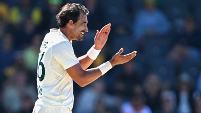Australia's Mitchell Starc claps his hands while his team plays Bangladesh during the second day of their second cricket test match in Mackay (AP) Australia's Mitchell Starc claps his hands while his team plays Bangladesh during the second day of their second cricket test match in Mackay (AP)