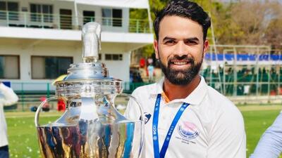 Left-arm spinner Abid Mushtaq posing with the cup after Jammu & Kashmir’s Ranji Trophy victory in February, 2026. (Source pic) Left-arm spinner Abid Mushtaq posing with the cup after Jammu & Kashmir’s Ranji Trophy victory in February, 2026. (Source pic)