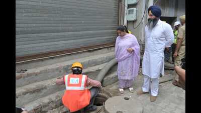 Mayor Inderjit Kaur inspected the work on Wednesday and said restoring the capacity of the old sewer line would improve sewage flow. (HT Photo)