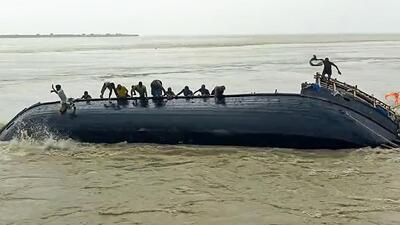The labourers in the boat were placing sandbags into the Ganga to stop erosion after the flood situation worsened following a breach in the embankment two days ago, inundating several villages. (ANI)
