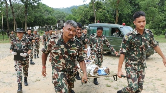 Nepal Army personnel conduct a rescue operation following a flash flood caused by an outburst in the Bhotekoshi River, on Wednesday.