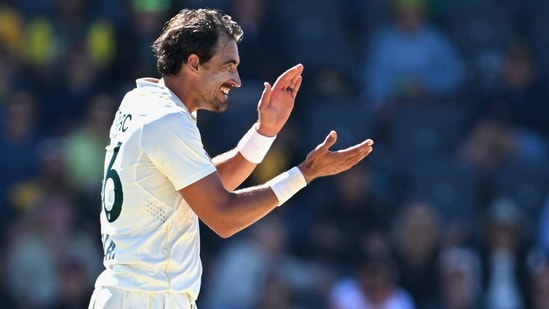 Australia's Mitchell Starc claps his hands while his team plays Bangladesh during the second day of their second cricket test match in Mackay