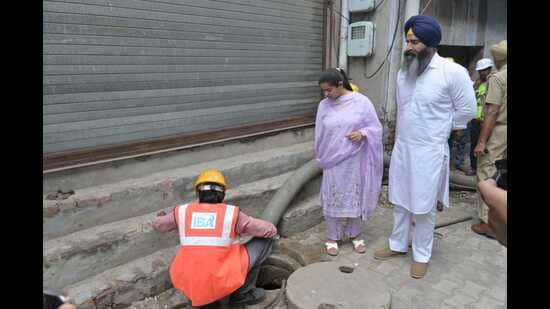 Mayor Inderjit Kaur inspected the work on Wednesday and said restoring the capacity of the old sewer line would improve sewage flow. (HT Photo)