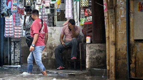 Massive waterlogging is seen inside Teliwara Market in the Sadar Bazaar area , in New Delhi.